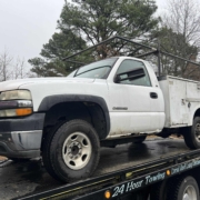 white silverado work truck with service body