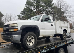 white silverado work truck with service body